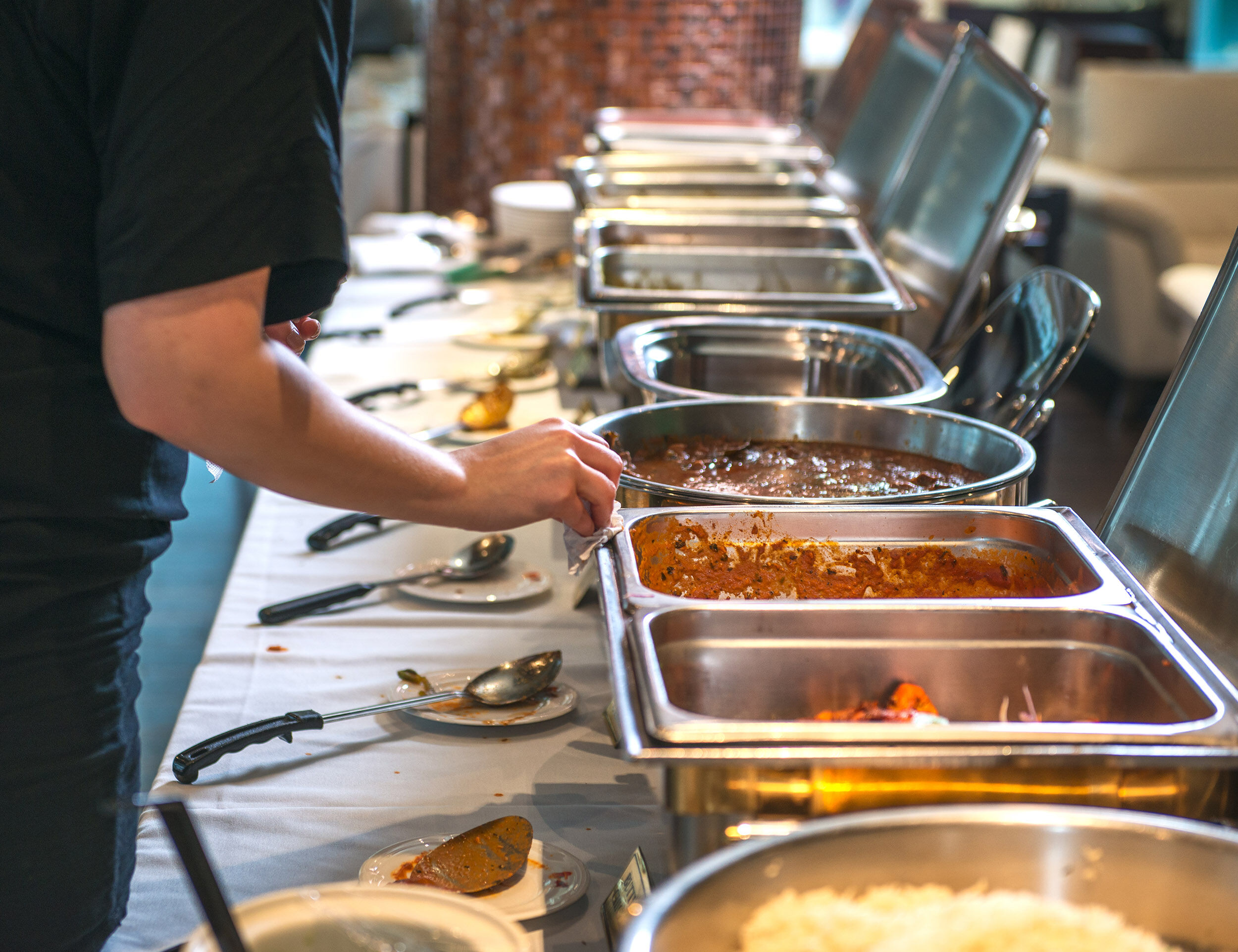 Lavish wedding buffet counter featuring delicious main course dishes.